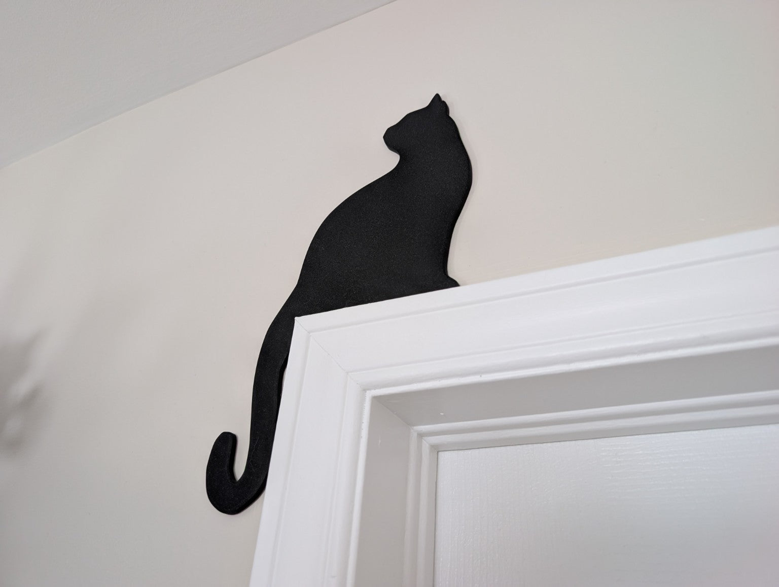 Chat décoratif pour cadrage de porte